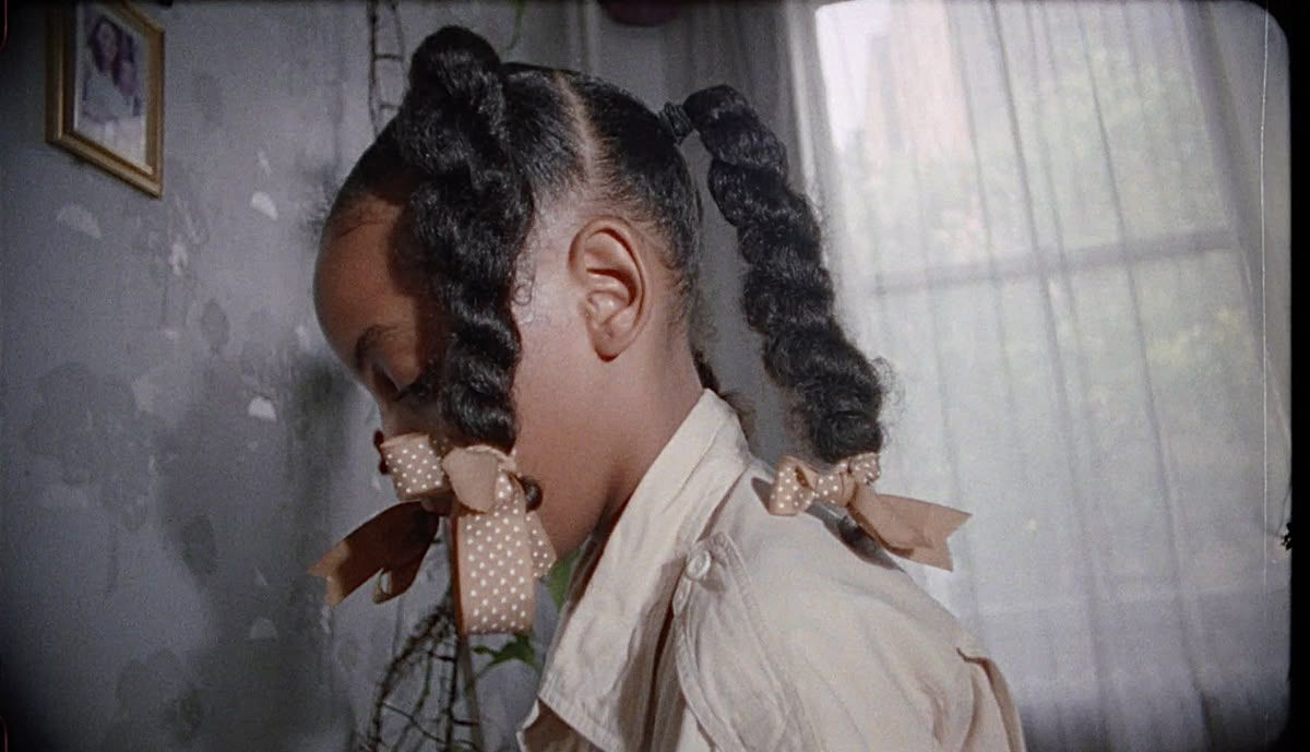 A young girl with ribboned braids — visual reference